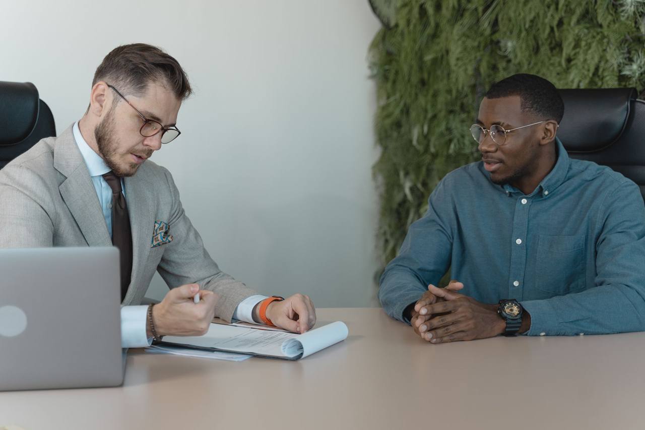 Two men in a job interview in a modern office